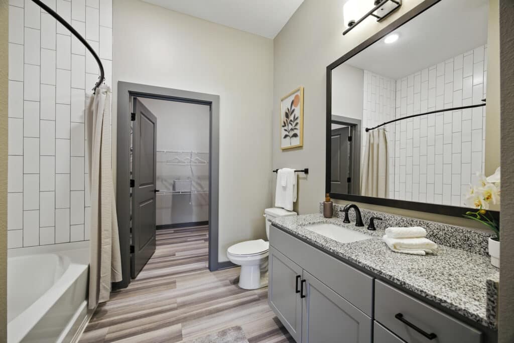 A bathroom with a mirror and sink.